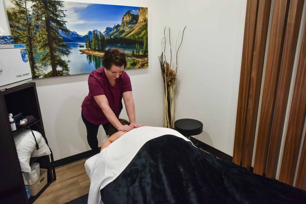 Jessica Koch with Patient | Complete Health | Chiropractic & Wellness Center | SW Calgary
