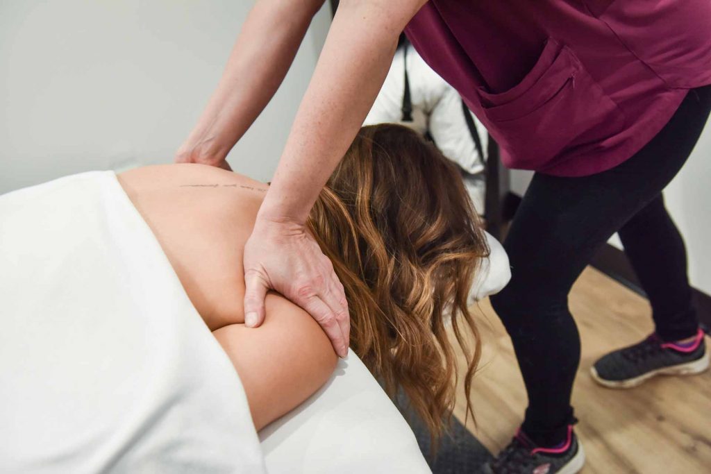 Jessica Koch with Patient | Complete Health | Chiropractic & Wellness Center | SW Calgary