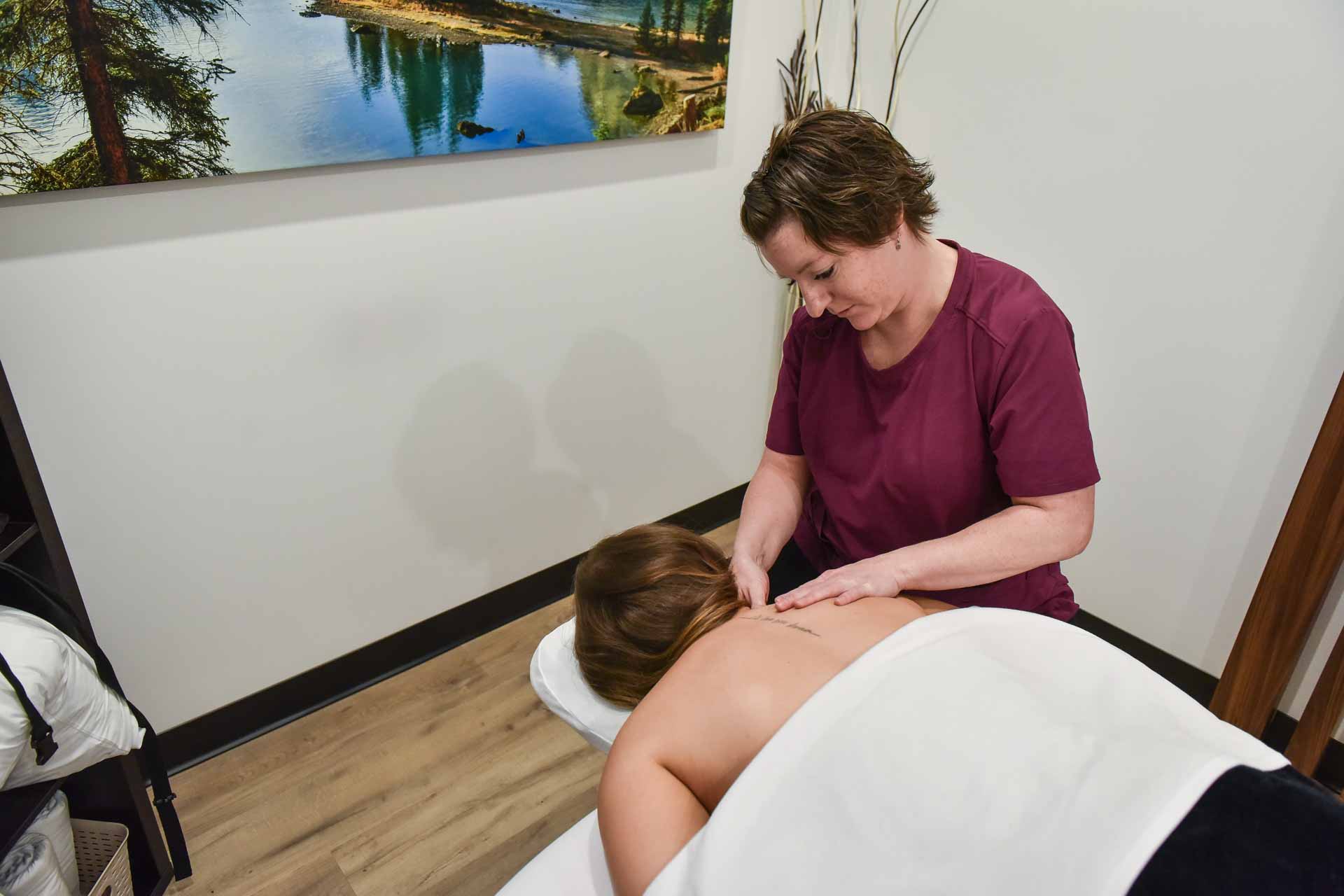 Jessica Koch with Patient | Complete Health | Chiropractic & Wellness Center | SW Calgary