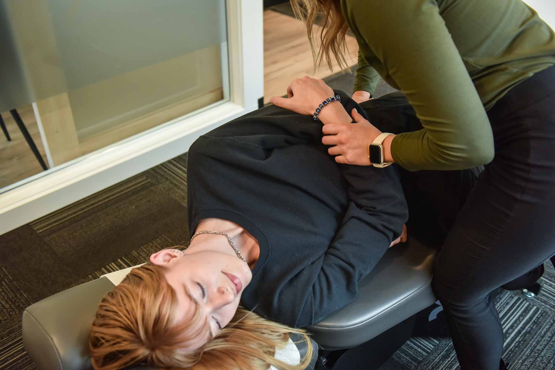 Dr. Jaycee George with Patient | Complete Health | Chiropractic & Wellness Center | SW Calgary