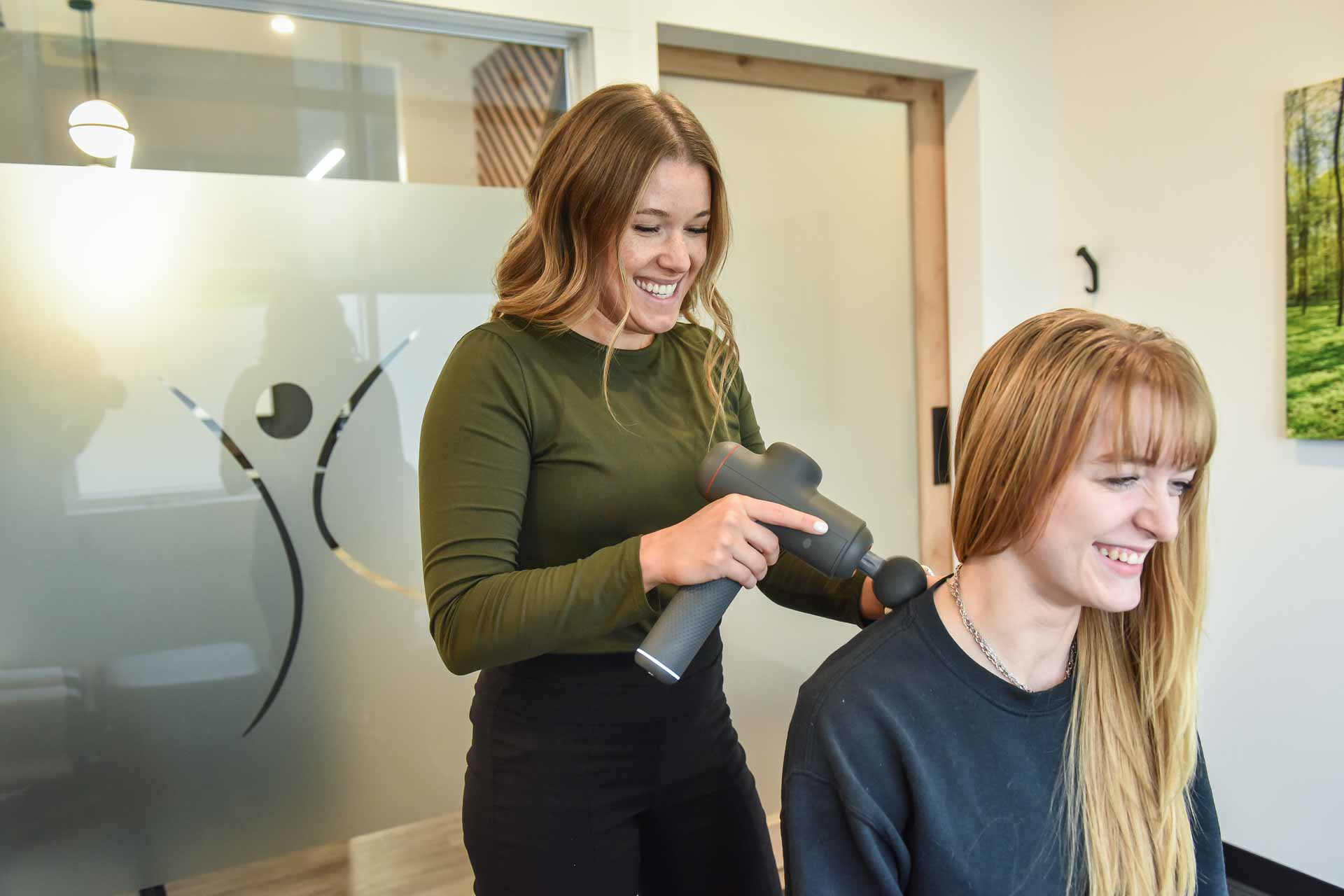 Dr. Jaycee George with Patient | Complete Health | Chiropractic & Wellness Center | SW Calgary