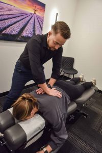 Dr. Carson Penner with Patient | Complete Health | Chiropractic & Wellness Clinic | SW Calgary