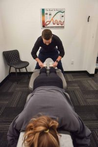 Dr. Carson Penner with Patient | Complete Health | Chiropractic & Wellness Clinic | SW Calgary