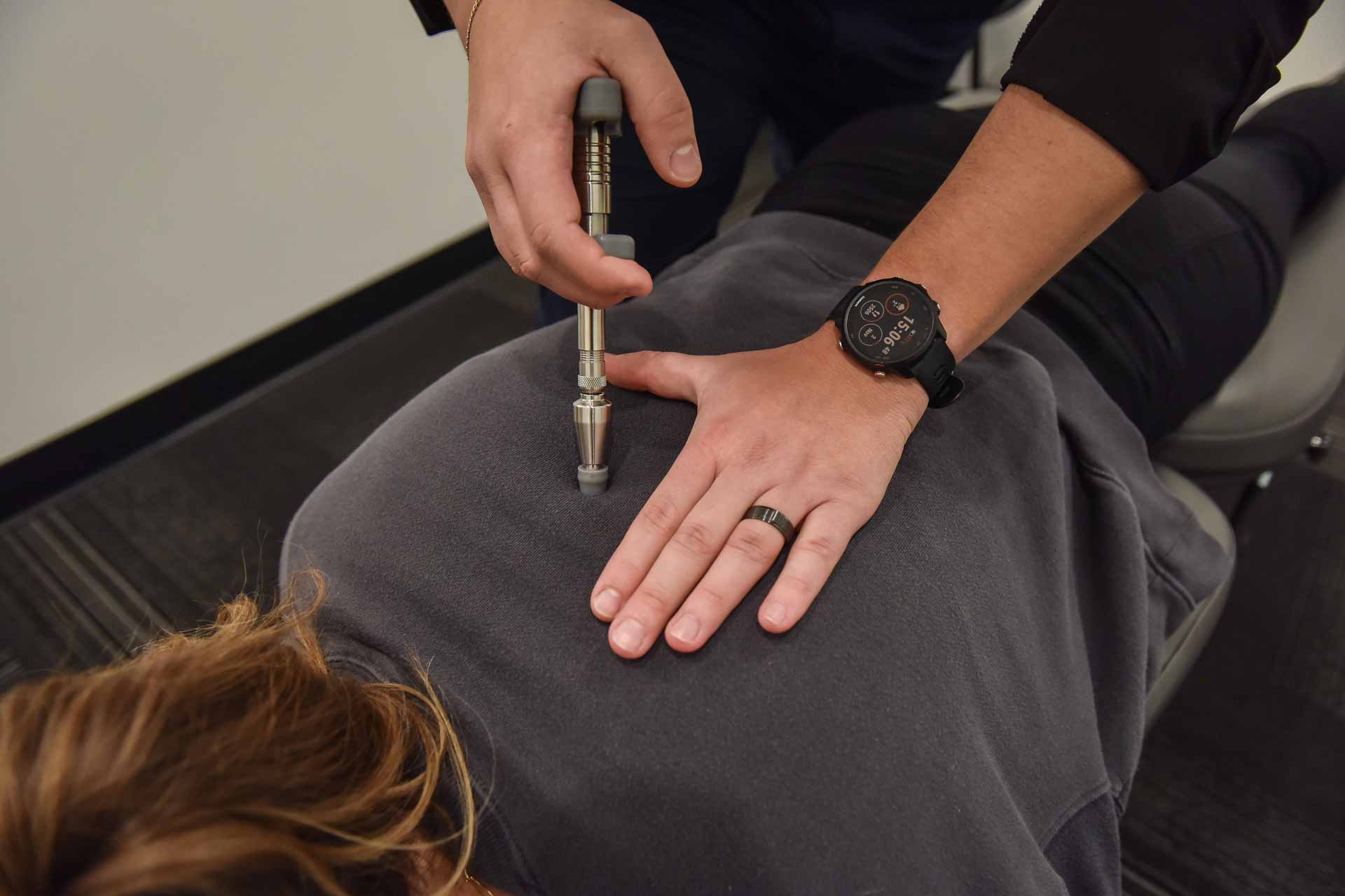 Dr. Carson Penner with Patient | Complete Health | Chiropractic & Wellness Clinic | SW Calgary